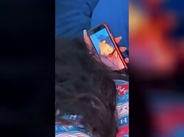 Watching herself on the phone